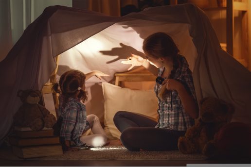 Mother,Scares,Child,Daughter,Tells,Scary,Stories,,Plays,In,The