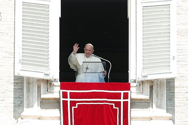 Pope Francis leads the Regina Coeli prayer from his window at St. Peter’s Square
