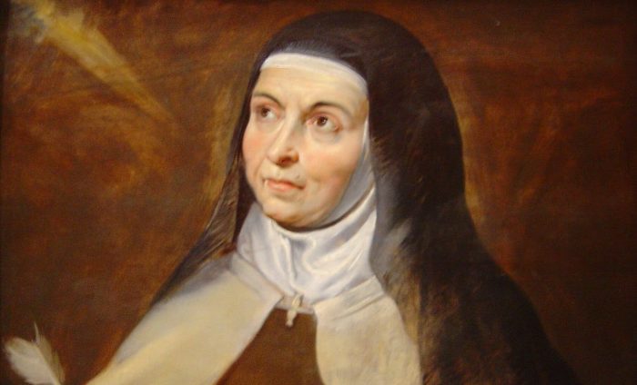 Teresa_of_Avila Santa Teresa D'Ávila segurando um livro e uma pena para escrever.