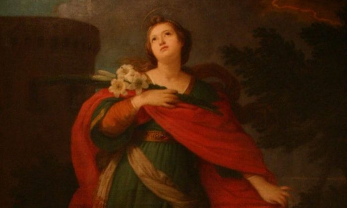 santa-barbara Santa Bárbara segurando buquê de flores e olhando para cima.