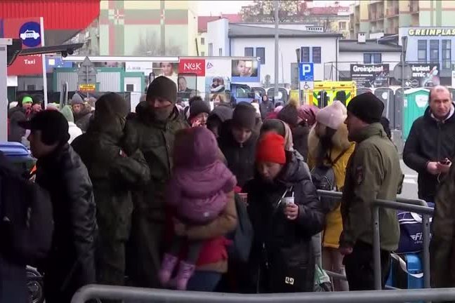 Refugees from Ukraine pour into in Polish camp close to border