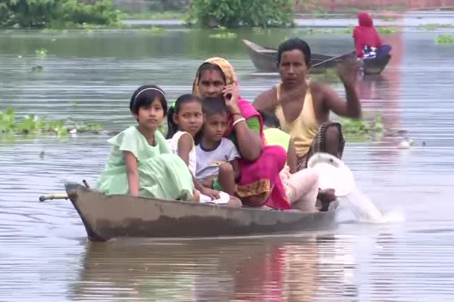 Thousands take shelter on highway in India’s flood-ravaged Assam